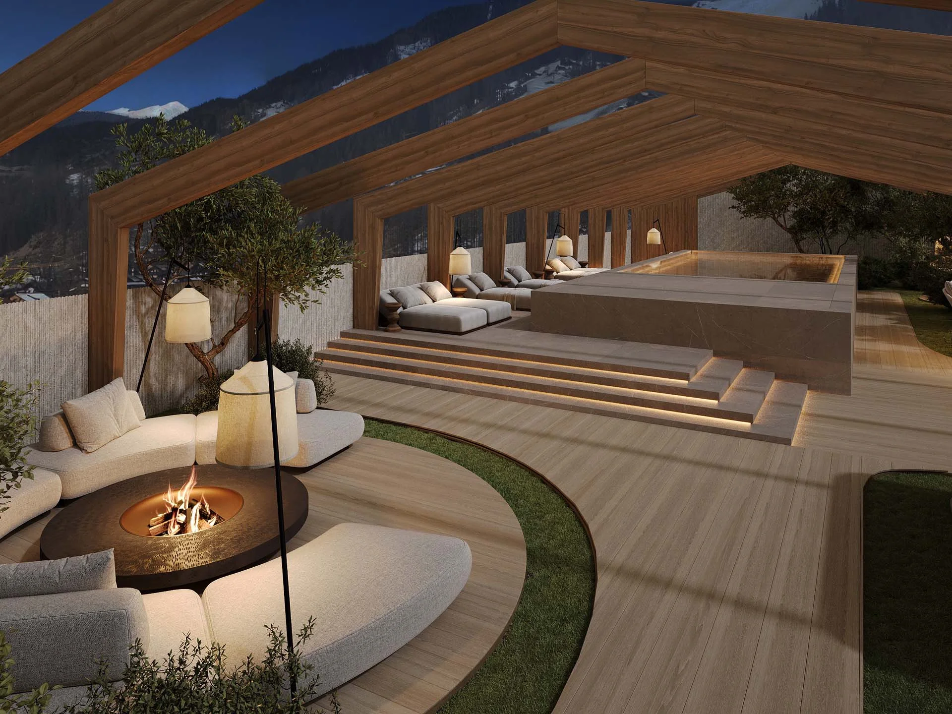 Hotel Monika: wohltuender Day Spa im Pustertal Moderner Außenbereich mit Feuerstelle, Liegen und Holzstruktur bei Nacht