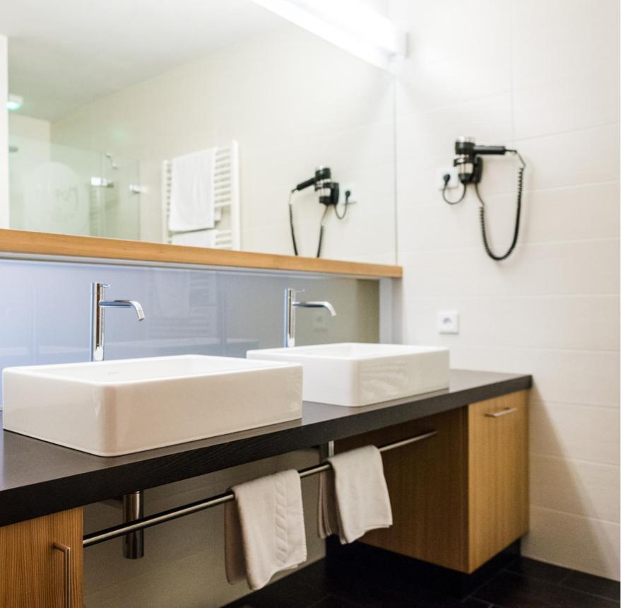 Bathroom with a shower and two sinks